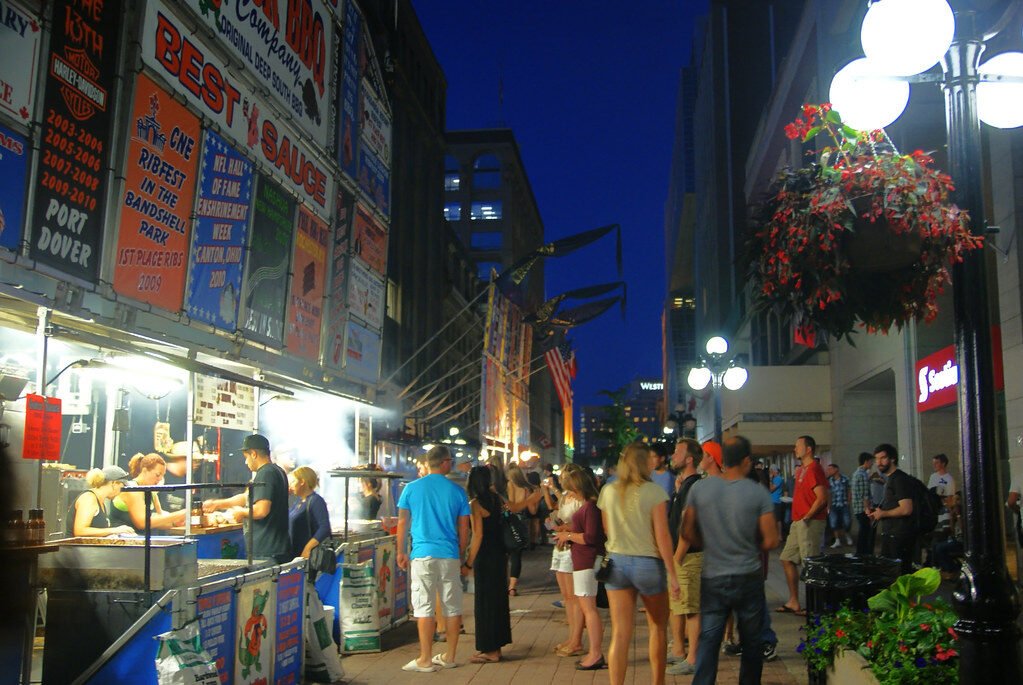 a sunflower in a field with a blue sky in the background